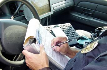 police ticketing windshield